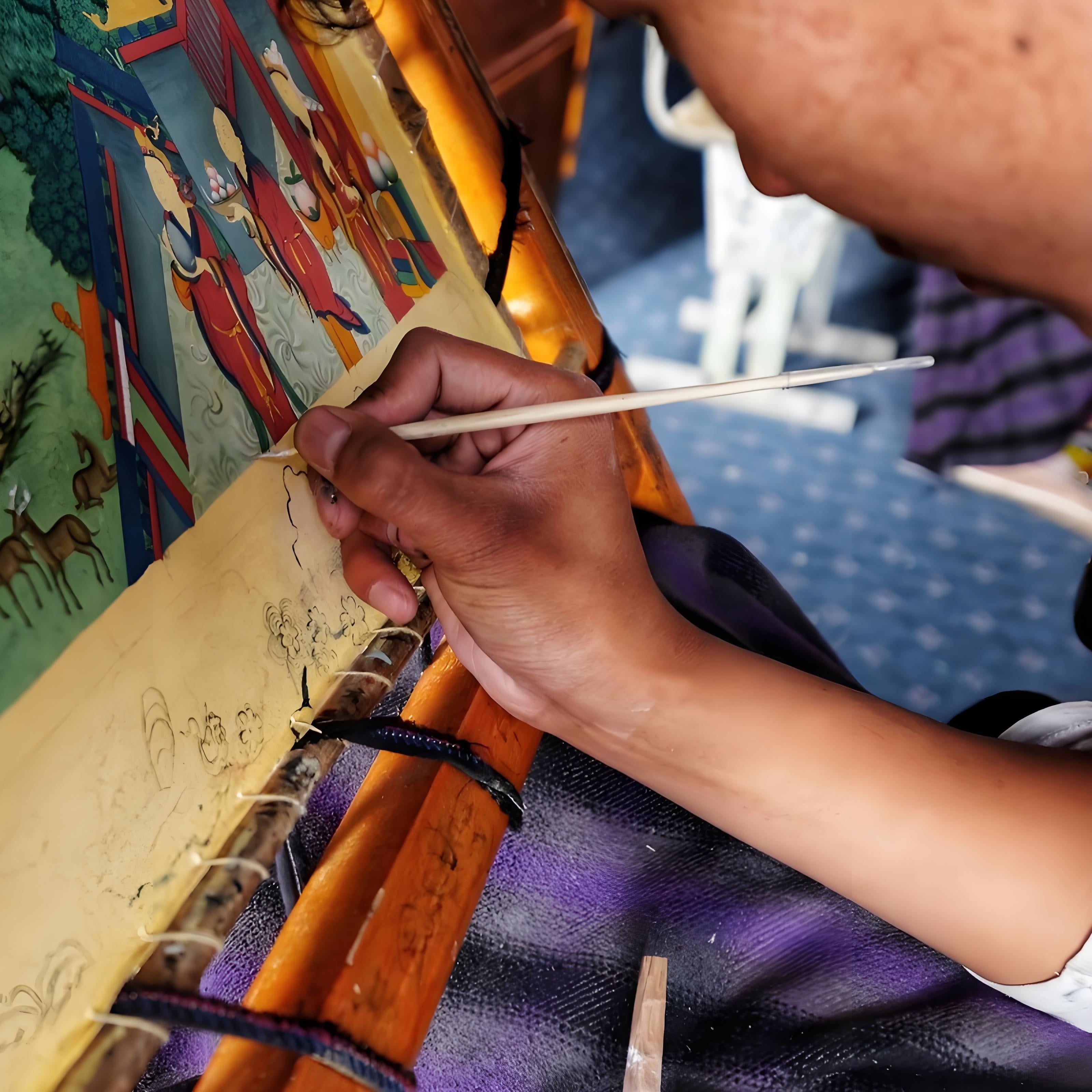 Hand-painted Tibetan Thangka in process, showing intricate painting details and craftsmanship