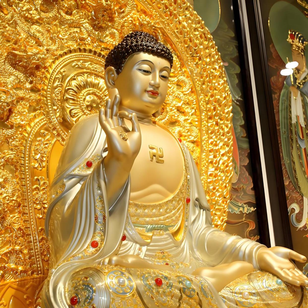 Tathagata Buddha golden statue image, showing solemn and sacred Buddha with golden glow